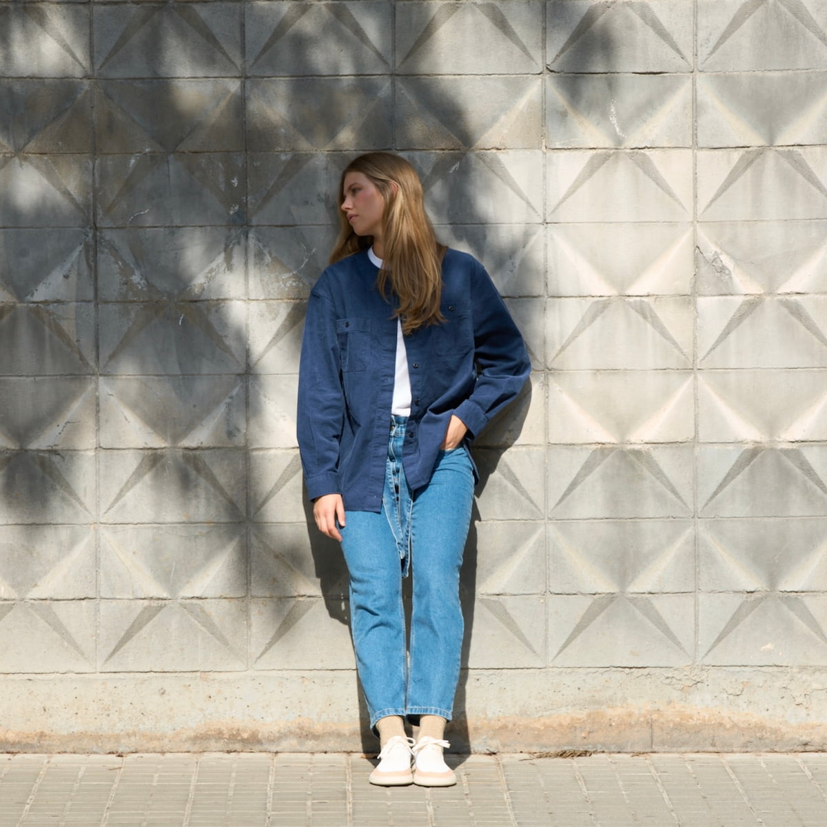Girl wearing white, pink, gold, and leopard-print barefoot sneakers.