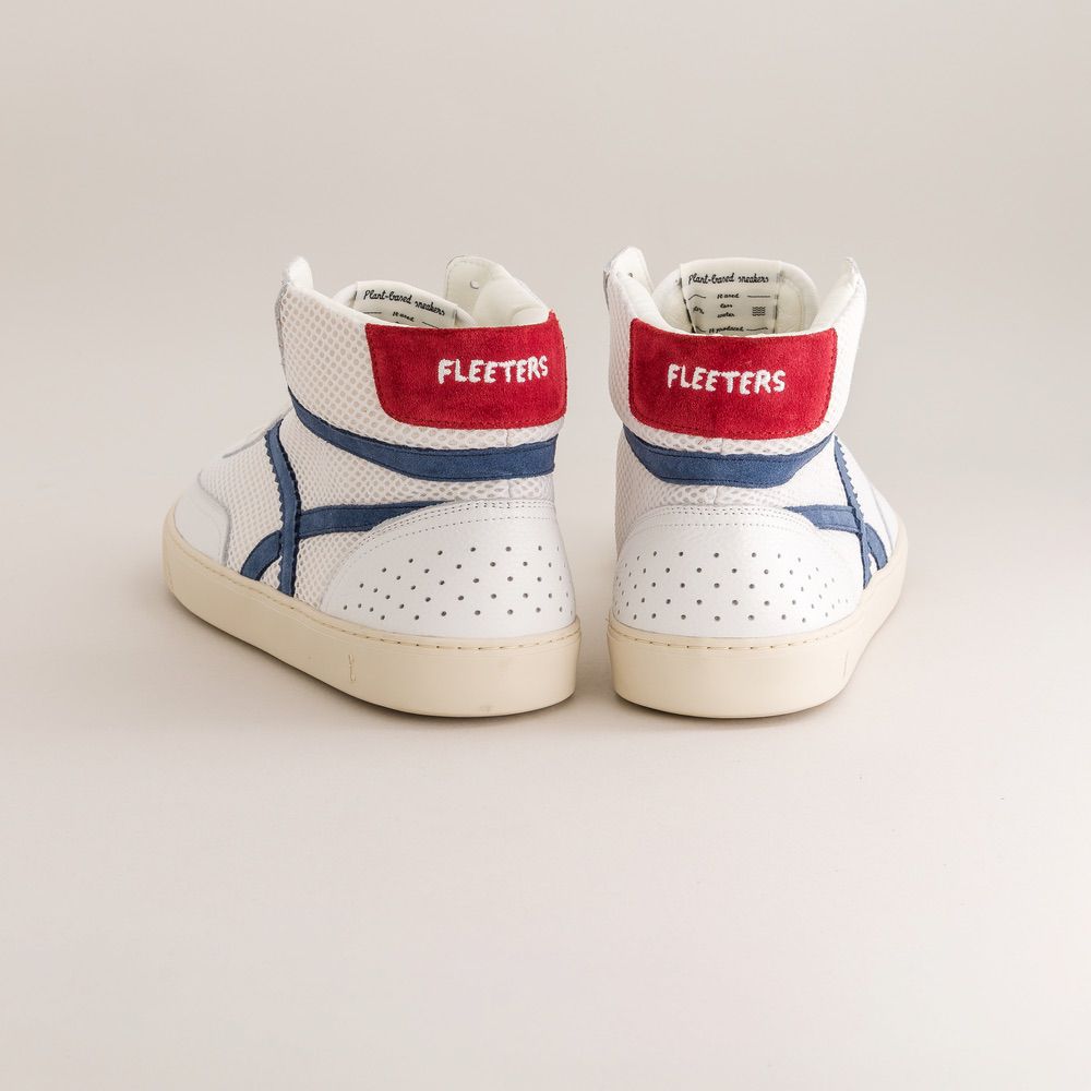 White high-top barefoot sneakers with red and blue accents on a light gray background