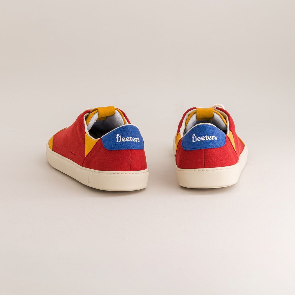 Red sneakers with colorful accents and 'fleeters' branding on a light gray background
