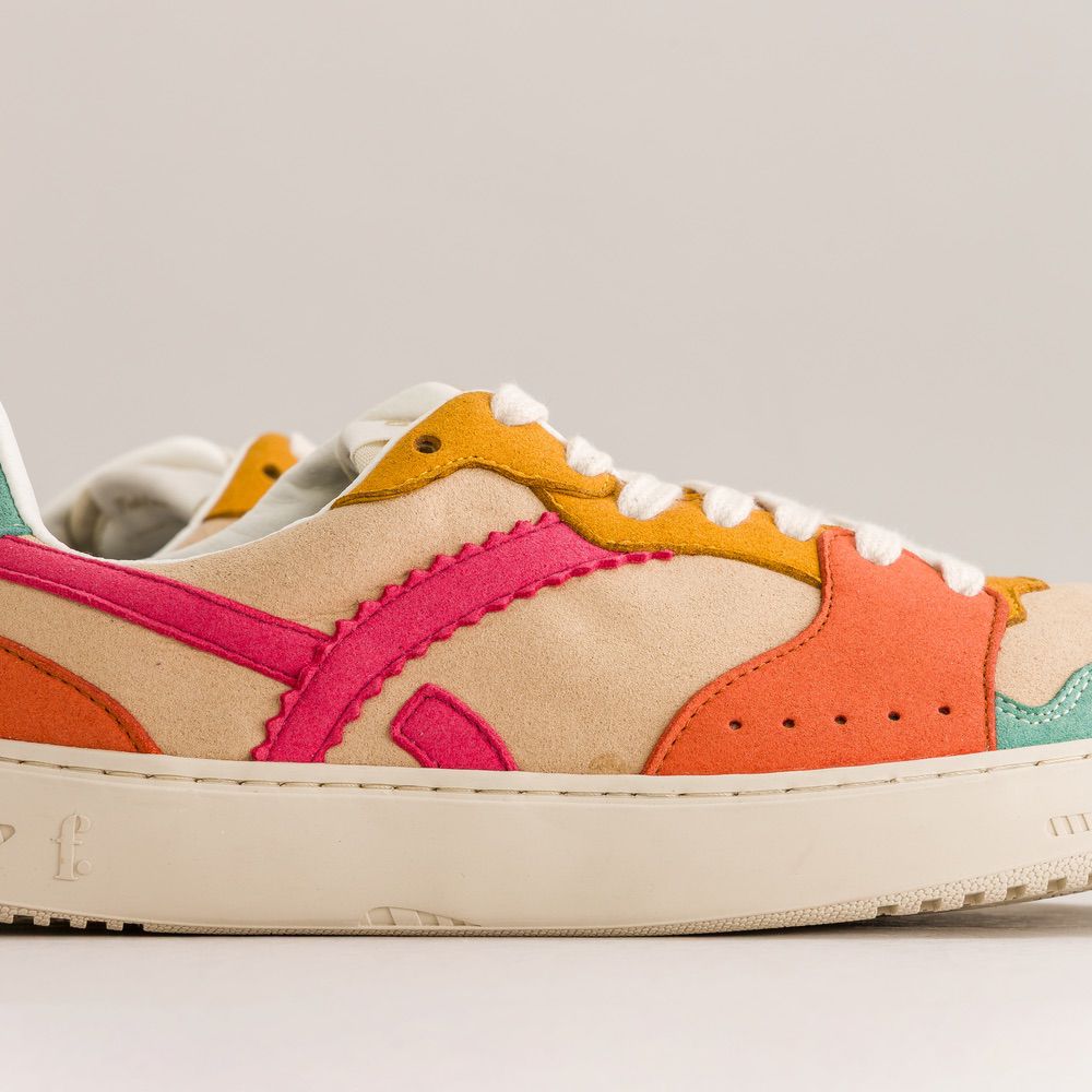 Colorful sneaker with a geometric design on a light gray background
