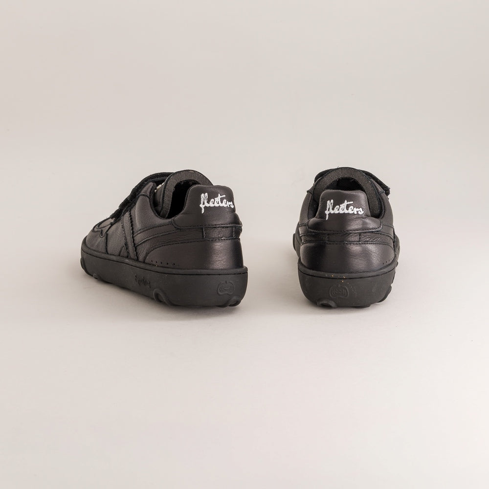 Pair of black kids barefoot shoes with 'Fleeters' branding on a light gray background
