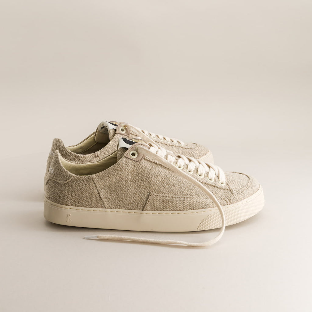 Beige barefoot sneakers in wool on a light gray background