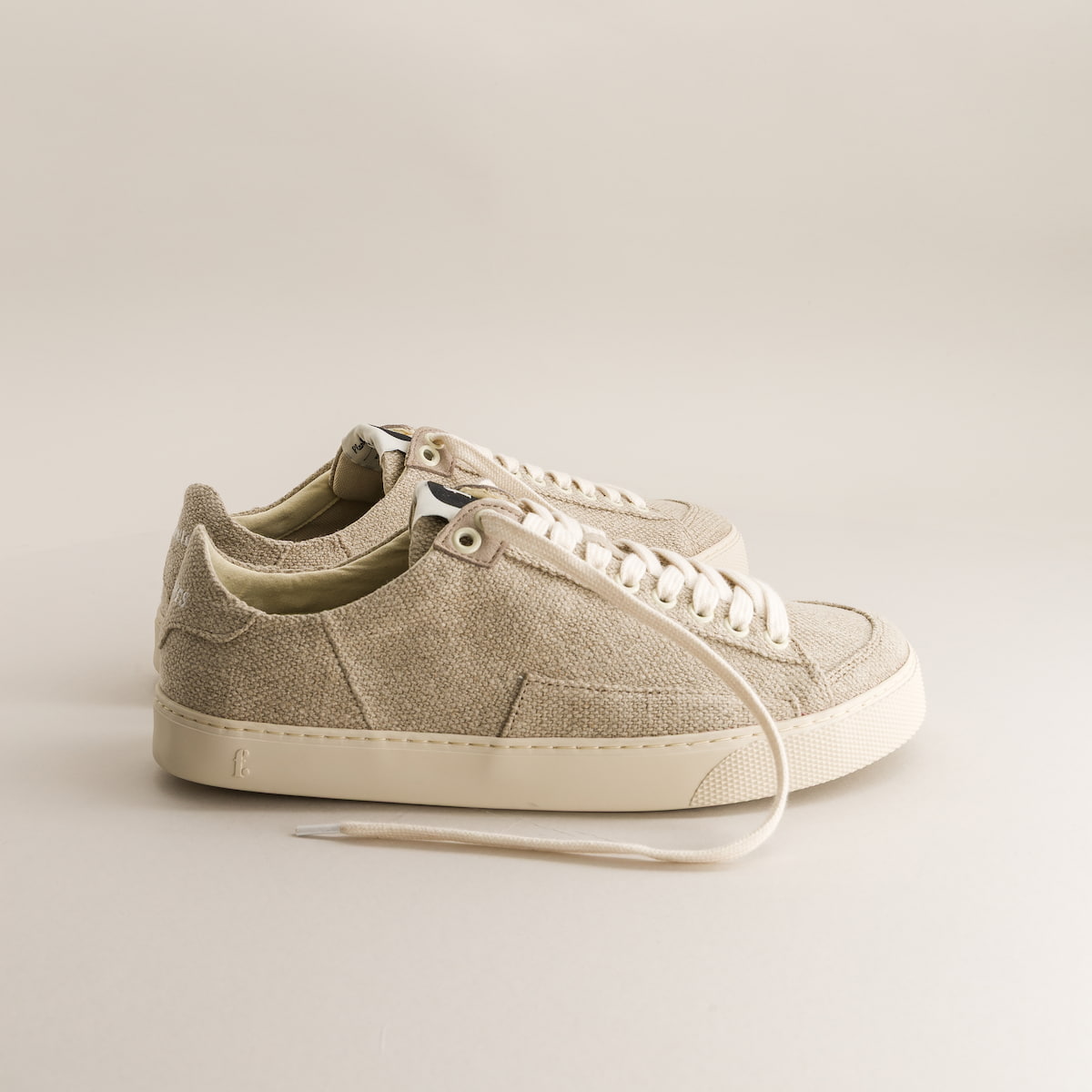 Beige barefoot sneakers in wool on a light gray background